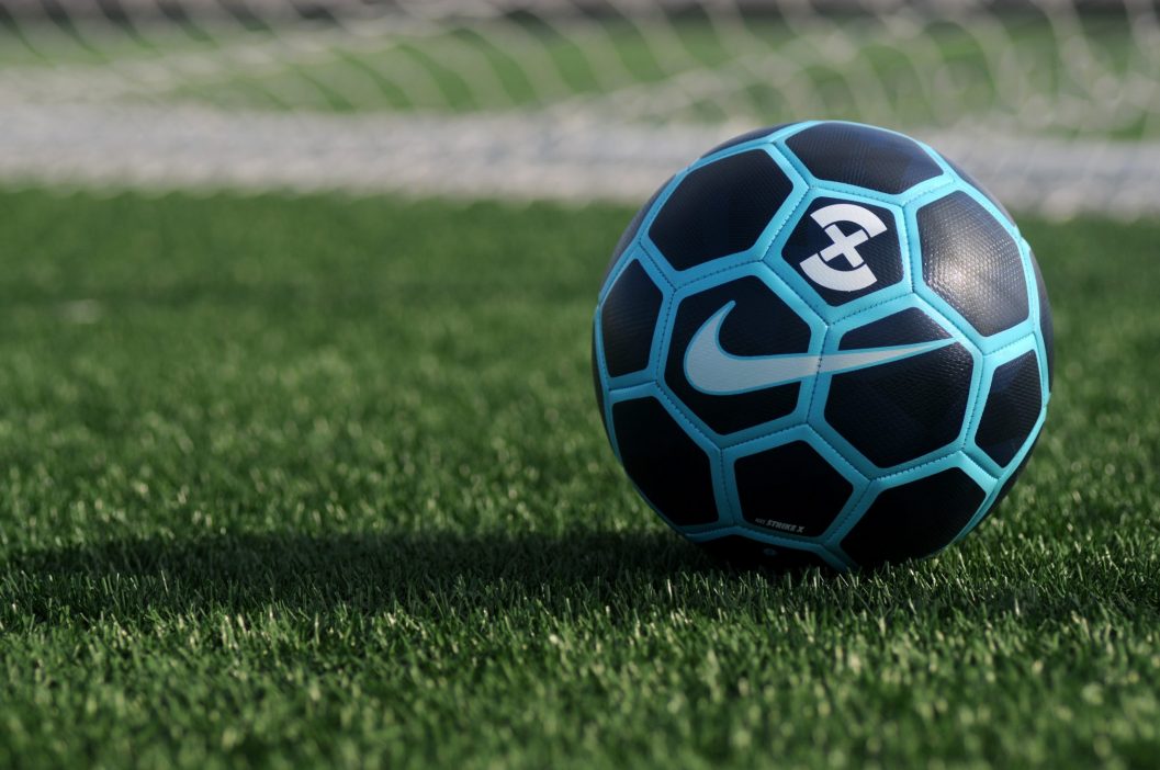 blue football on astro turf